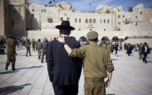 Soldier and ultra-Orthodox man, shoulder to shoulder (Yonatan Sindel/Flash90)