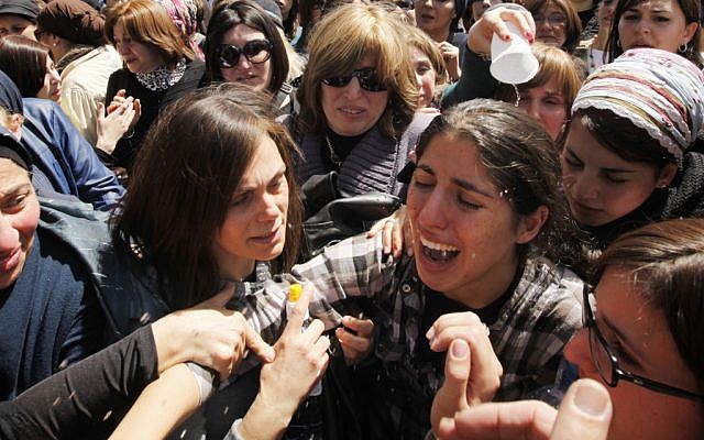 The sister of 8-year-old Miriam Monsonego cries at the Jerusalem funeral of Miriam and the three other Toulouse Jewish school shooting victims. (photo credit: Miriam Alster/Flash90)