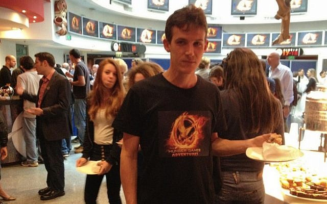 A Funtactix employee sports a T-shirt with the logo of The Hunger Games Adventures online game (Photo credit: Courtesy)