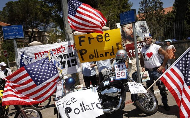 Demonstrators hold signs calling for the release of Jonathan Pollard during a demonstration in 2012 (photo credit: Miriam Alster/Flash90)