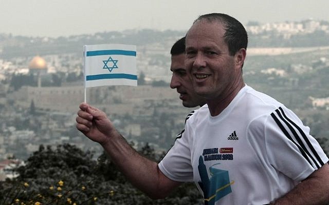 Jerusalem Mayor Nir Barkat takes part in the Jerusalem Marathon wearing an Adidas sponsored shirt (photo credit: Kobi Gideon/Flash90)