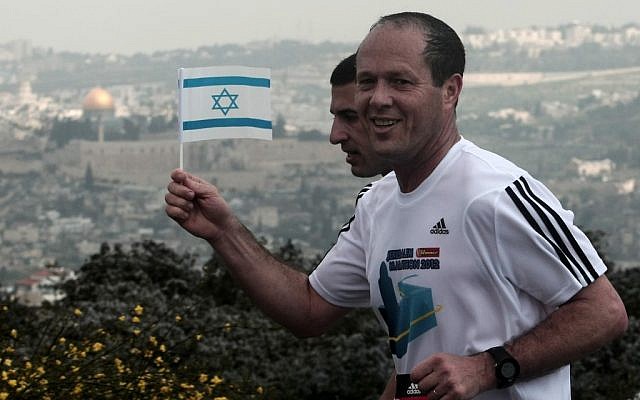 Jerusalem Mayor Nir Barkat running the Jerusalem Marathon in an Adidas shirt in March. (photo credit: Kobi Gideon/Flash90)