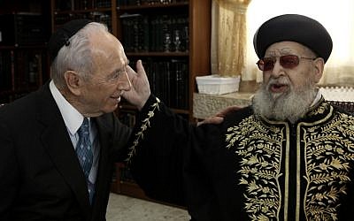 Israeli President Shimon Peres shaking hands with the spiritual leader of the ultra-orthodox Shas party, Rabbi Ovadia Yosef , on Sunday (photo credit: Kobi Gideon/Flash90)