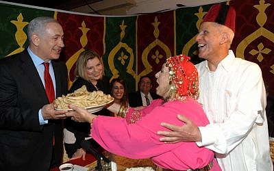 Benjamin and Sara Netanyahu celebrating the Mimouna, a traditional Jewish-Moroccan holiday that follows the end of passover (Amos Ben Gershom/Flash90)