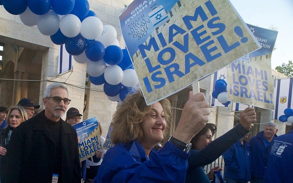 Ana and Steven Weisman and Stephanie Trump march to Jerusalem's Jaffa Gate during the 2012 'mega event' of the Greater Miami Jewish Federation’s mission of 700 people to Israel. (Randi Sidman-Moore/JTA)