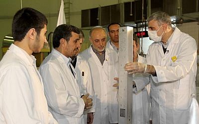 Then Iranian President Mahmoud Ahmadinejad, second from left, visits a nuclear research facility in Tehran in February 2012 (AP/Iranian President's Office)