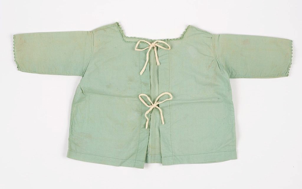 The shirt worn by Nina Denty Abayov's baby brother, found in their Athens home after the war (Courtesy Yad Vashem)