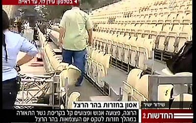The spot where a lighting rig that toppled and collapsed at Mount Herzl struck seats. (photo credit: screen capture from Channel 2 News)