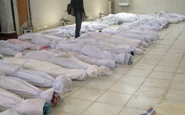 Dead bodies following the assault on Houla, Syria, in May (photo credit: AP/Shaam News Network. AP cannot independently verify this photo)