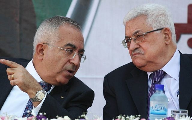 Former Palestinian Authority Prime Minister Salam Fayyad (left) with Palestinian Authority President Mahmoud Abbas in 2012 (Issam Rimawi/Flash90/ File)