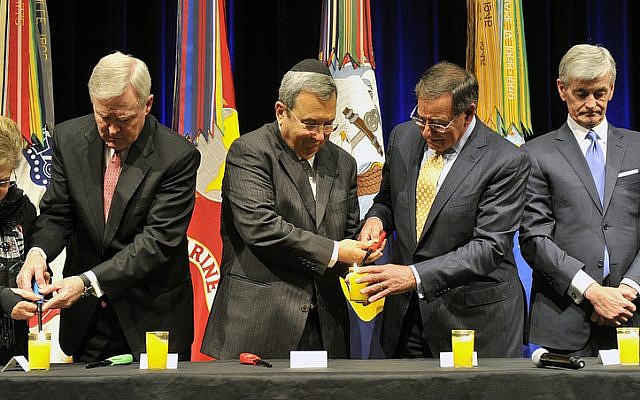 Barak (second left) and Panetta (second right) during a memorial ceremony in Washington, April 19 (photo credit: Ministry of Defense/Flash90)