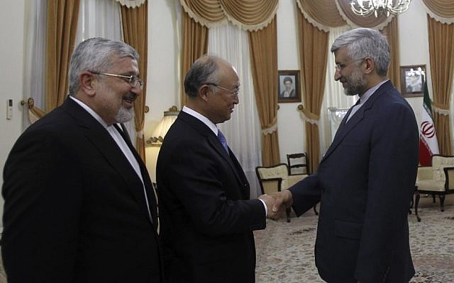 IAEA chief Yukiya Amano, center, meets with Iran's top nuclear negotiator Saeed Jalili, right, and Iran's chief delegate to the IAEA, Ali Asghar Soltanieh, in Tehran last May (photo credit: AP/IRNA/Adel Pazzyar)