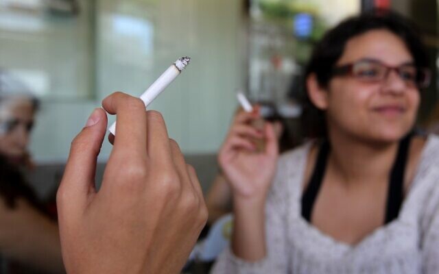 Illustrative photo of people smoking cigarettes. (Nati Shohat/Flash90)