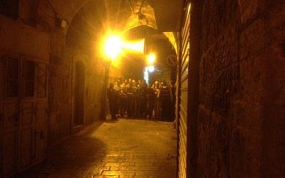 Arab residents of the Old City waiting for the procession to pass (Photo credit: Mitch Ginsburg)