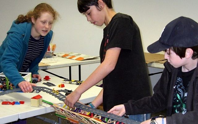Tech-Know-Play campers work on a bridge engineering project (Photo credit: courtesy)
