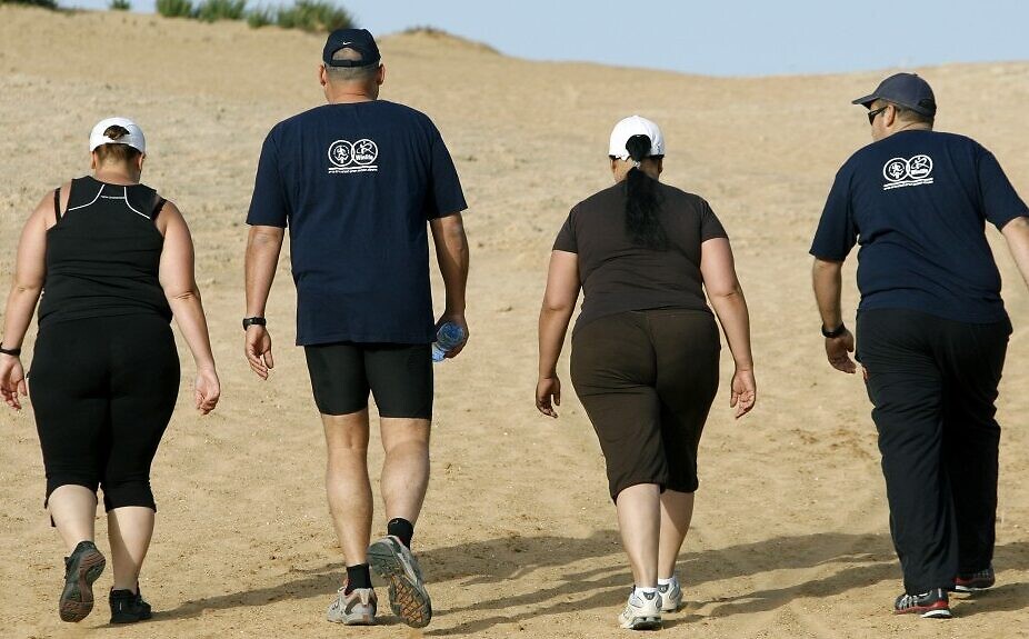 Overweight people hike at the Wingate institute (Photo credit: Moshe Shai/Flash90)