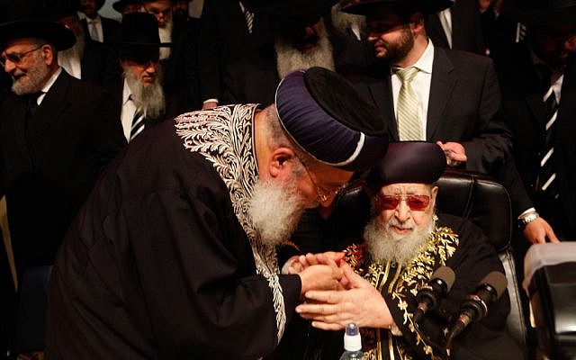 Late Shas spirtual leader Rabbi Ovadia Yosef (seated) and Chief Sephardi Rabbi Shlomo Amar during a Shas party Passover gathering, April 2012. (photo credit: Uri Lenz/Flashh90)