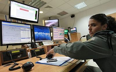 An Israeli soldier in front of computer monitors (illustrative photo credit: Nati Shohat/Flash90)