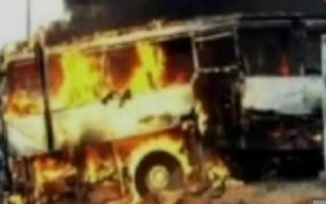 A tour bus that was attacked in the Bulgarian city of Burgas burns on Wednesday (photo credit: Channel 10 screen capture)
