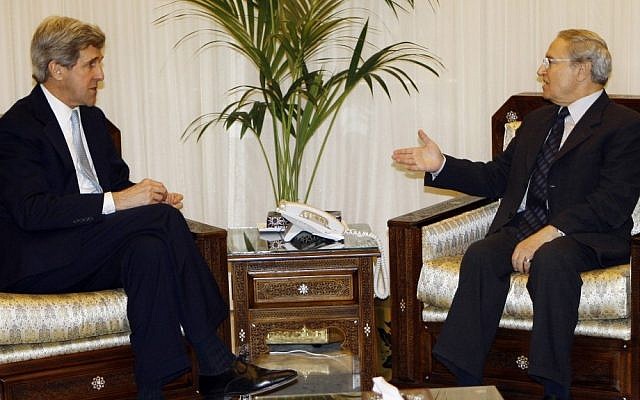 Farouk al-Sharaa, right, meeting with US Senator John Kerry in Damascus in 2009. (photo credit: AP/Bassem Tillawi)