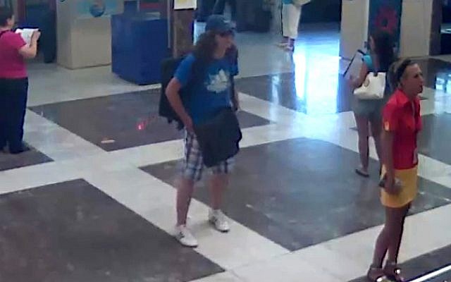 This image taken from security video provided by the Bulgarian Interior Ministry on Thursday, July 19, 2012, purports to show the Burgas bomber, center, with long hair and wearing a baseball cap, at Burgas Airport in Bulgaria, on Wednesday, July 18, 2012. (photo credit: Bulgarian Interior Ministry/AP)