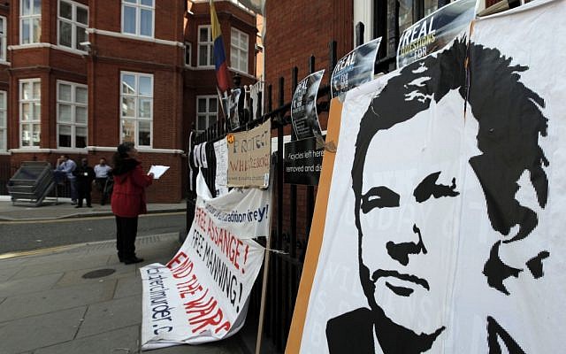 Placards and messages placed by supporters of WikiLeaks founder Julian Assange outside the Ecuador Embassy in London in late June, where Assange attempted to gain political asylum. (photo credit: Lefteris Pitarakis/AP)