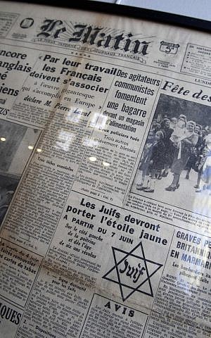 The front page of daily newspaper Le Matin reading "Jews must wear the yellow star starting July 7", from the Archives of Paris Police Prefecture (photo credit: Remy de la Mauviniere/AP)