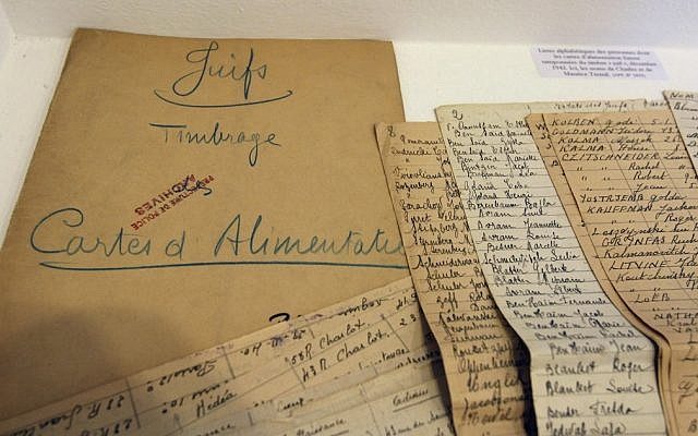 Names of French Jews deported by the police to Auschwitz, from the Archives of Paris Police Prefecture (photo credit: Remy de la Mauviniere/AP)