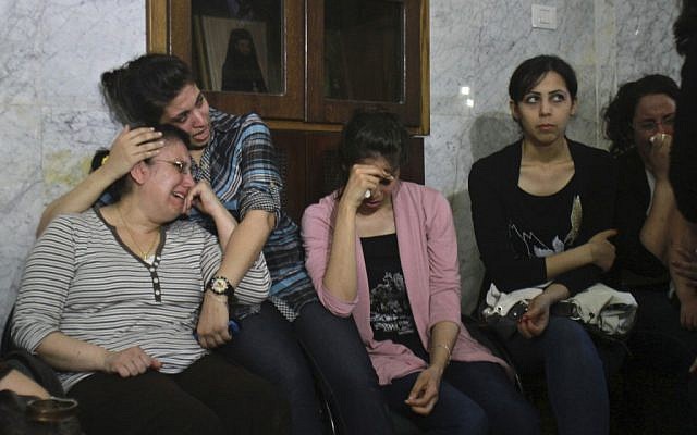Palestinian Christians cry during a rally against the forced conversions of two individuals. (photo credit: AP/Adel Hana)