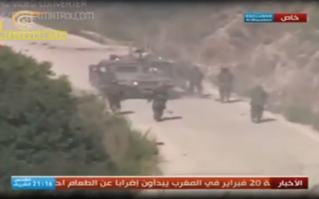 Hezbollah gunmen converge on the stricken Hummer of Regev and Goldwasser, in footage released by Hezbollah on Friday. (photo credit: screenshot)