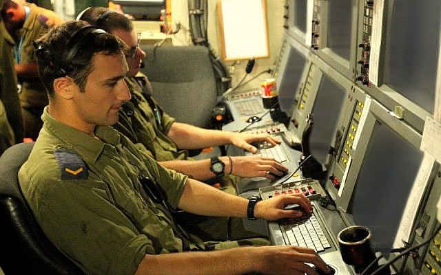 IDF soldiers work with cyber-defense systems. (photo credit: Moshe Shai/Flash90/File)
