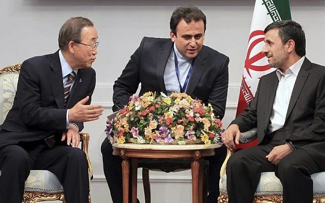 Ban Ki-moon, left, speaking to Mahmoud Ahmadinejad through a translator on Tuesday. (photo credit: (AP/Presidency Office, Mohsen Rafinejad)