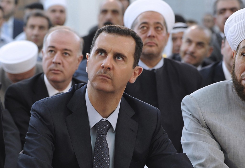 Illustrative Syrian President Bashar Assad performs Eid prayers in the Hamad Mosque in Damascus August 19