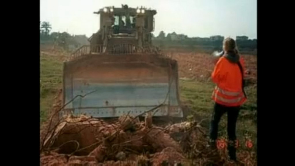 Rachel-Corrie-faces-the-bulldozer-in-Gaza.jpg