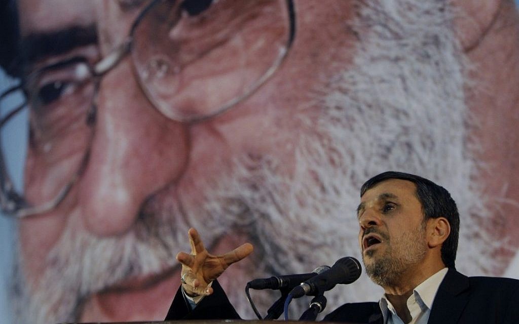 Then-Iranian president Mahmoud Ahmadinejad speaks in front of a portrait of supreme leader Ayatollah Ali Khamenei in 2012 (AP/Vahid Salemi)