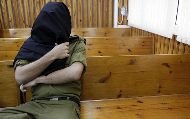 Illustrative: An IDF soldier sits in a military court. (Tsafrir Abayov/Flash90)