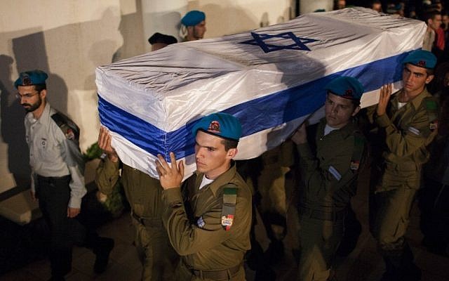 Israeli soldiers carry the coffin of Netanel Yahalomi during his funeral in the Israeli city of Modiin, early Sunday, September 23, 2012. Yahalomi was killed Friday in a shootout between Islamist terrorists and IDF troops along Israel's southern border with Egypt. (photo credit: Yonatan Sindel/Flash90