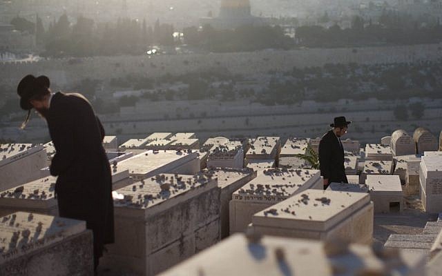 Ultra-Orthodox Jews visit graves at the cemetery on the Mount of Olives, September 2012. (Yonatan Sindel/Flash90)