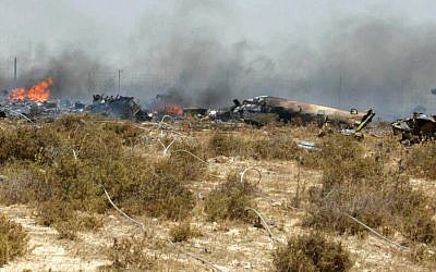 Israeli soldiers and rescue team members stand at the scene of an Israeli army helicopter crash, July 2006 (photo credit: Haim Azulai/Flash90)
