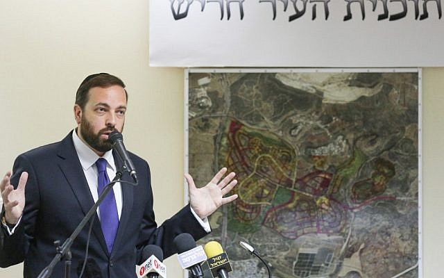 Ariel Atias, former minister of Housing and Construction, lays out the plans for the new ultra-Orthodox city of Harish in northern Israel in August  2012. (Oren Nahshon/Flash90)