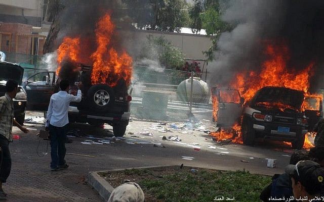 Cars burning from inside the US Embassy compound in Sanaa in September 2012. (photo credit: Haykal Bafana via Twitter)