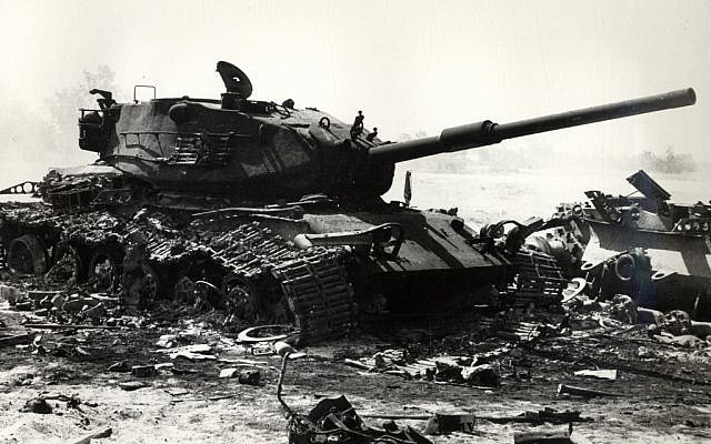 A wrecked Israeli tank during the early days of the Yom Kippur War (Wikimedia Commons)