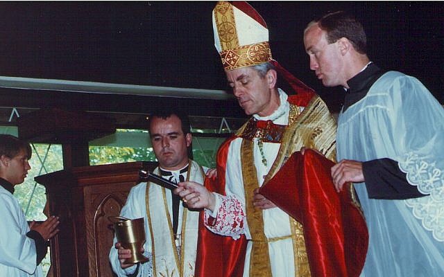 Bishop Richard Williamson at a confirmation ceremony in 1991. (photo credit: CC BY, Jim, the Photographer, Flickr)