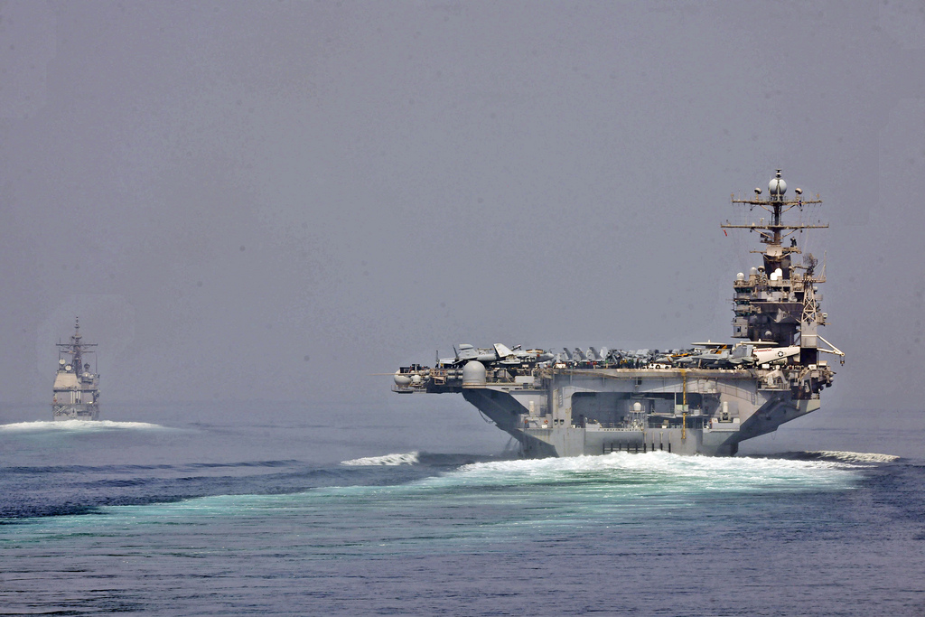 The guided-missile cruiser USS Cape St. George (CG 71) and the aircraft carrier USS Abraham Lincoln (CVN 72) transit the Strait of Hormuz (photo credit: CC BY Official U.S. Navy Imagery)