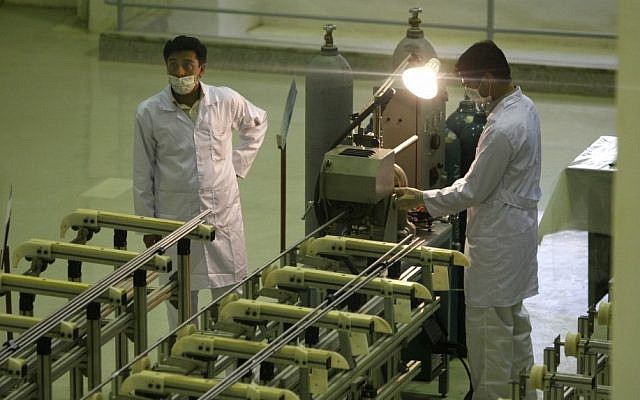 Iranian technicians work at a facility producing uranium fuel for a planned heavy-water nuclear reactor, outside Isfahan, 255 miles (410 kilometers) south of the capital Tehran, in 2009. (photo credit: AP/Vahid Salemi)