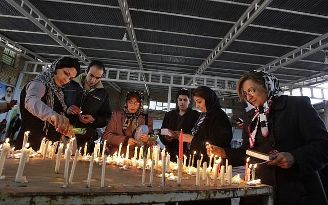 Iranian Jews light candles as they pray at the shrine of biblical prophet Daniel, in the city of Susa, some 450 miles (750 kilometers) southwest of the capital Tehran, February 2012 (photo credit: AP/Vahid Salemi)