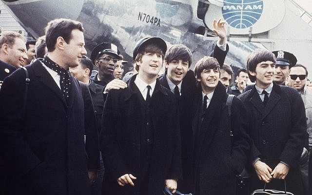 Brian Epstein (left) with The Beatles on tour in 1964. (AP Photo)
