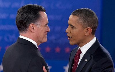 US President Barack Obama and Republican presidential candidate, former Massachusetts Gov. Mitt Romney, greet each other as they arrive for the presidential debate, Tuesday, Oct. 16, 2012, at Hofstra University in Hempstead, N.Y. (photo credit: Carolyn Kaster/AP)
