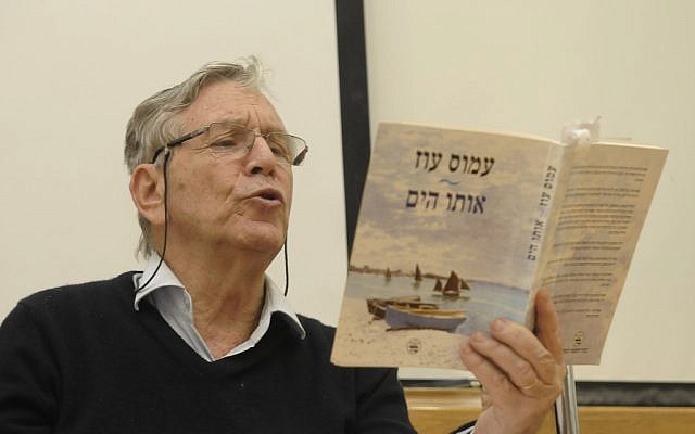 Amos Oz reading from one of his books in 2011. (photo credit: Tomer Neuberg/Flash90)