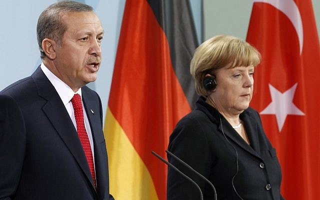 Germany Chancellor Angela Merkel and Turkey's Prime Minister Recep Tayyip Erdogan address the media during a joint press conference after a meeting at the chancellery in Berlin, Germany, in October 2012 (photo credit: AP/Michael Sohn)